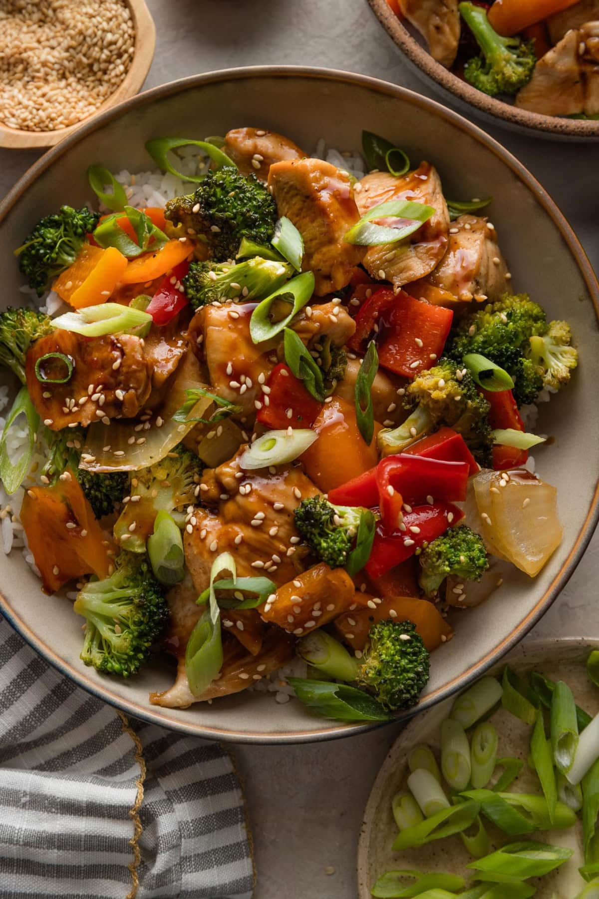 Bowl of chicken and veggies coated in a sweet and savory homemade teriyaki sauce.