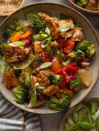 Bowl of chicken and veggies coated in a sweet and savory homemade teriyaki sauce.