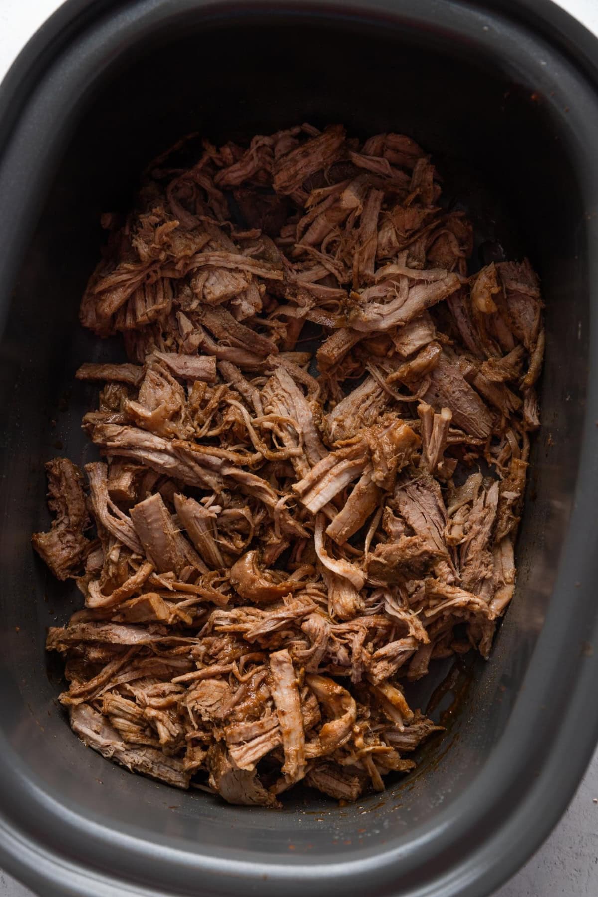 Crockpot full of apple cider pulled pork.
